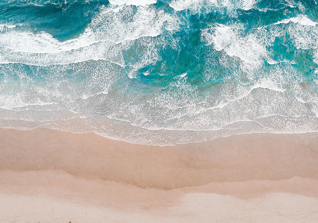 Ocean rolls onto a beach